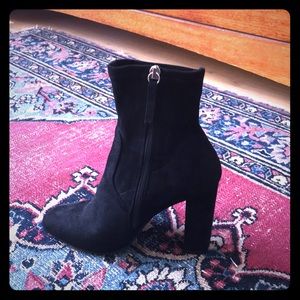 Heeled black suede ankle boots with inside zipper